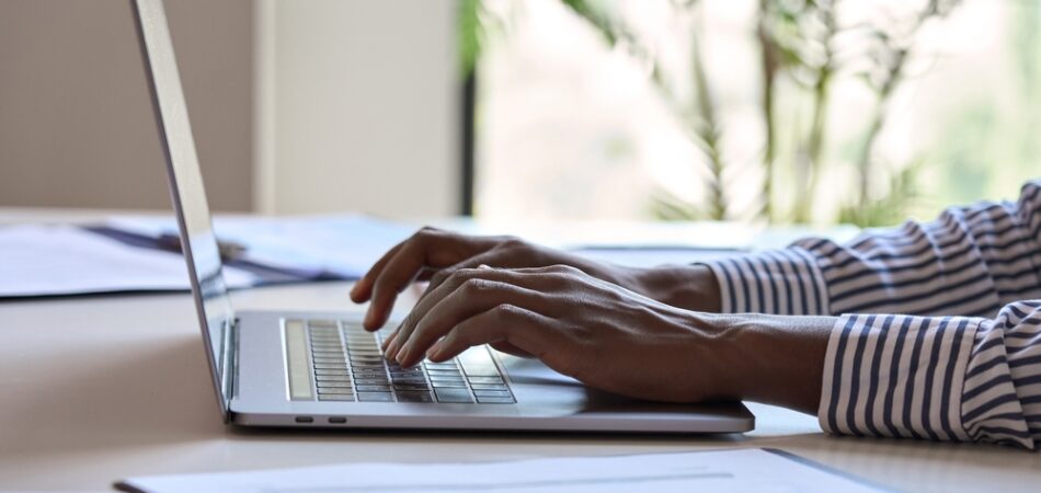 Young,black,female,hands,typing,on,pc,keyboard.,african,business