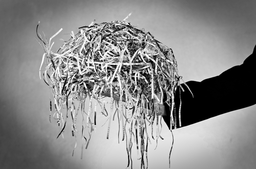 Businessman,holding,pile,document,destroyed